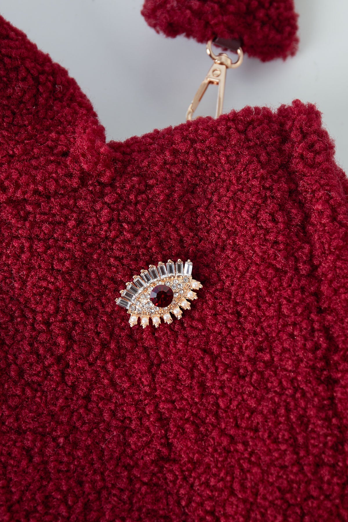 wondering eye brooch